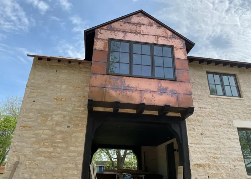 Copper metal panel facade on a stone building for Metal Roof Coating in Lakeland South