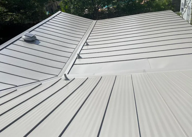 Solar attic fan installed on a metal roof for Roof Ventilation in Lakeland South